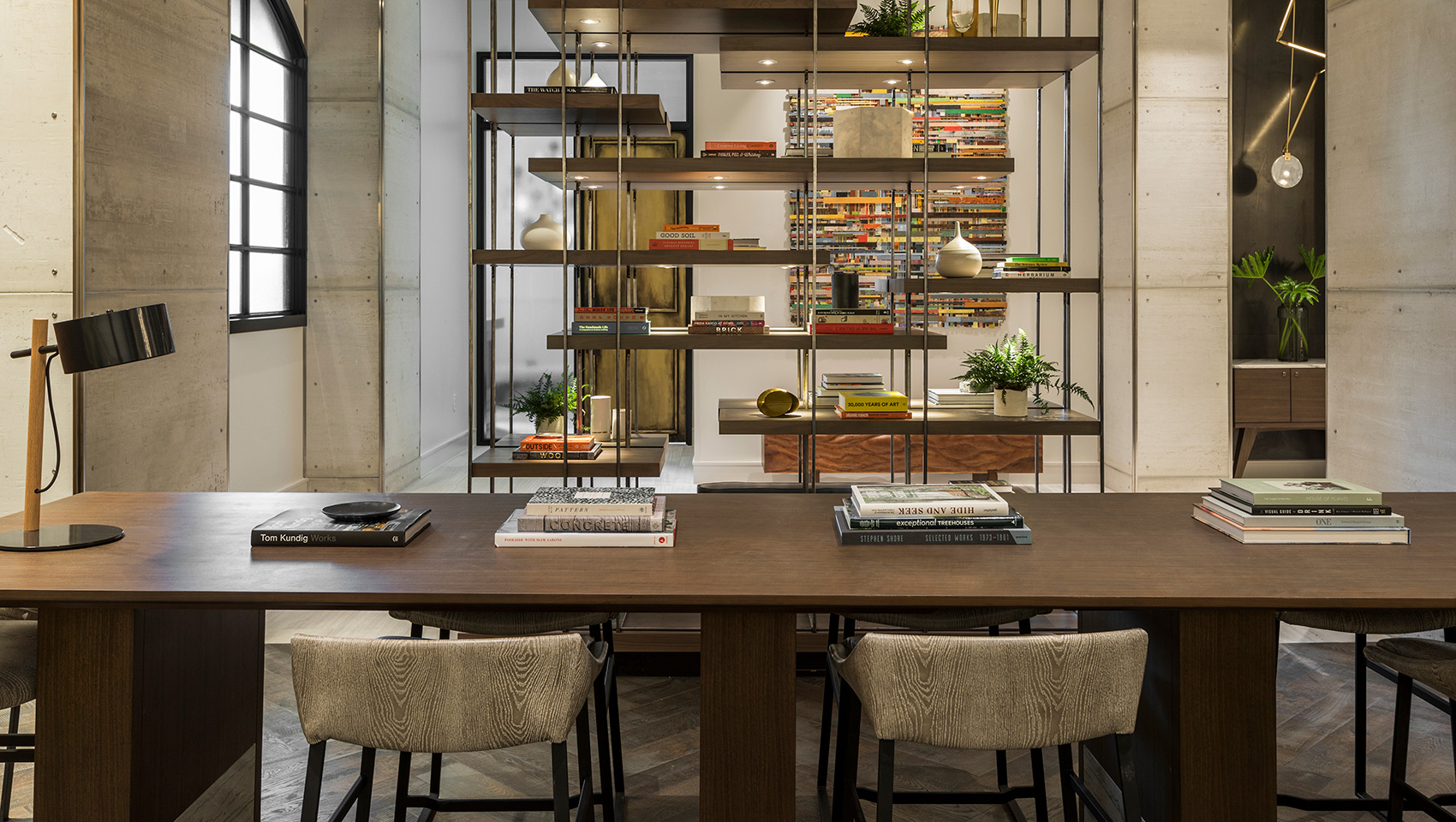 hotel lobby with shelves tables and chairs